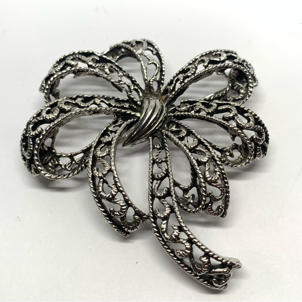 Vintage numbered Sphinx ribbon bow textured brooch